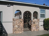 Custom masonry river rock veneer wainscot
