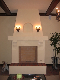 Spanish style stucco/plaster fireplace with Rumford style firebox and tiled hearth - Click here for larger view