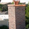 Custom Masonry Brick Chimney with copper chase cover and spark arrestor