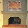 Custom Fireplace with spanish tile hearth under construction before plaster finish